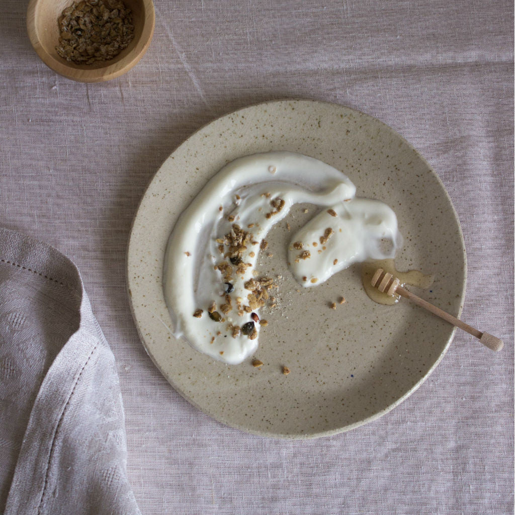 Clay plate with youghurt and honey, coated with ashes from local pines. Handmade in Mallorca. 